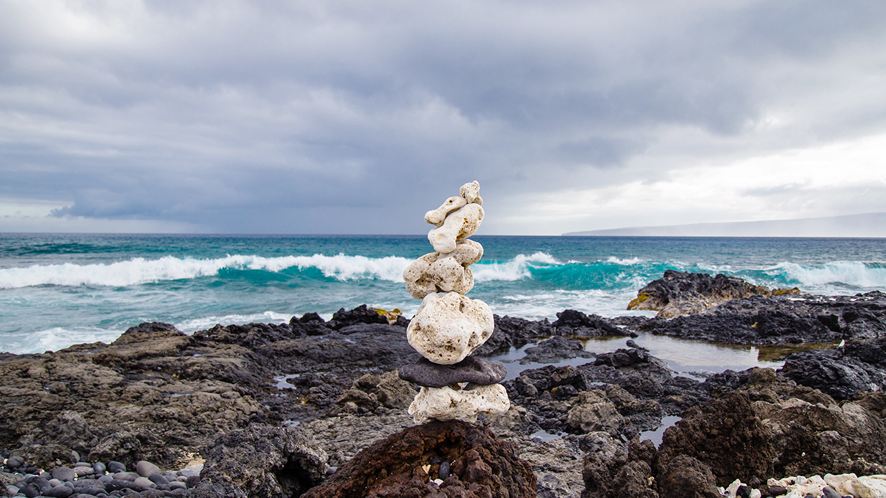 Stacked rocks in front of ocean